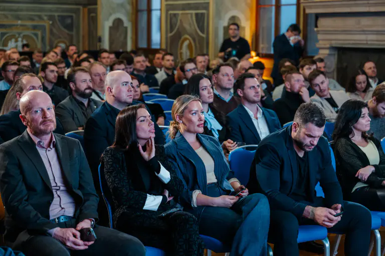 Delegates listening during a focused conference session