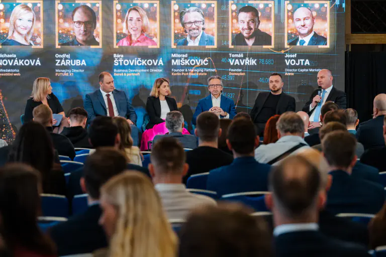 Panel discussion seen across a seated audience