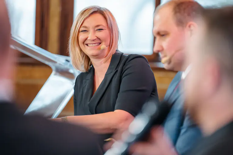 Close view of a speaker during a panel conversation