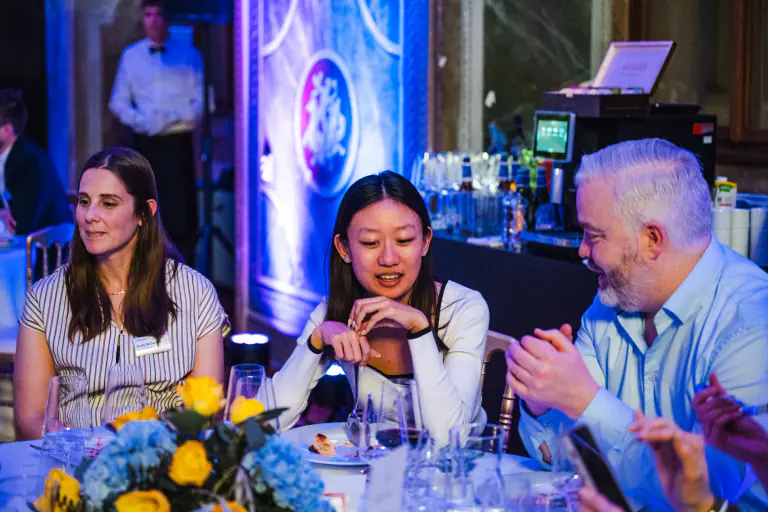 International guests enjoying dinner and conversation