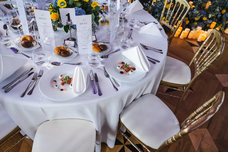 Overhead view of a carefully styled round dinner table