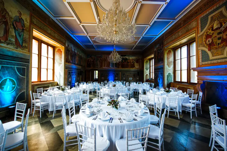 Formal technology event dinner in a painted Martinic Palace hall