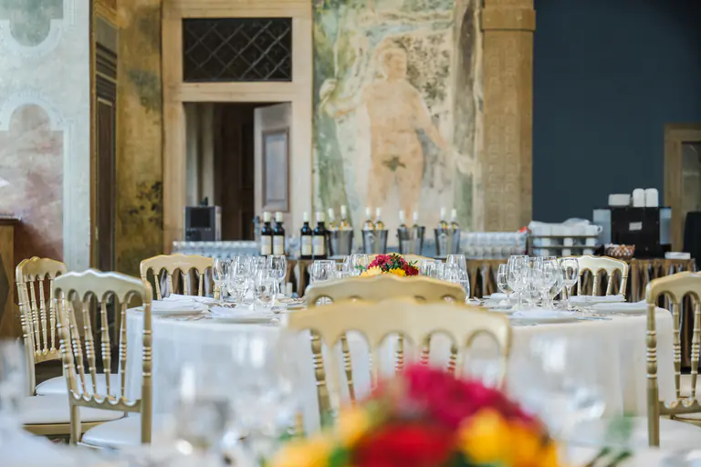 Glassware and floral details on a table prepared for dinner at Martinic Palace