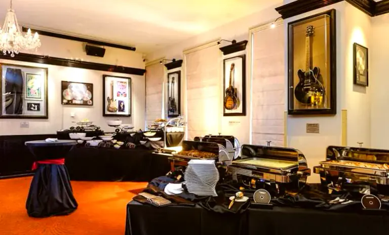 Buffet stations and framed guitars prepared for an event at Hard Rock Cafe Prague