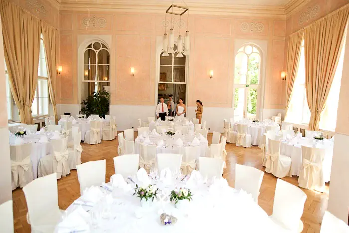 Letenský zámeček dining room arranged for a seated celebration