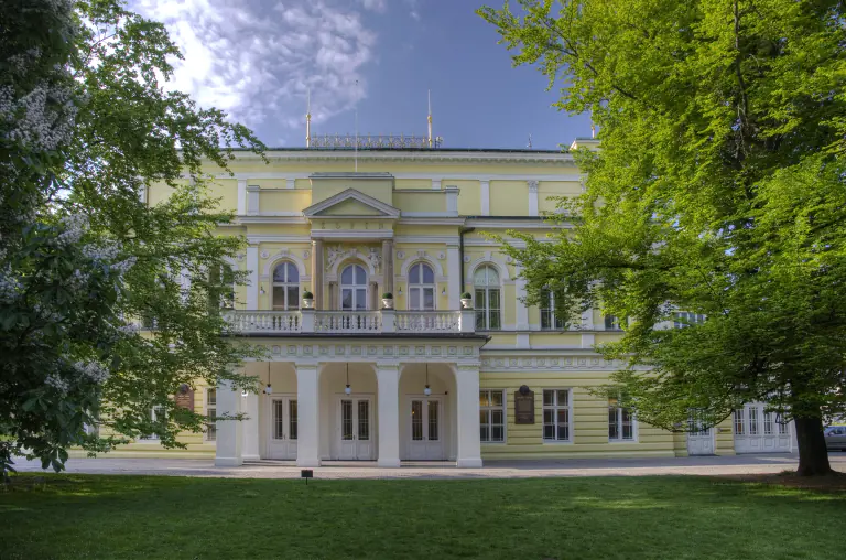 Žofín Palace neoclassical façade framed by trees